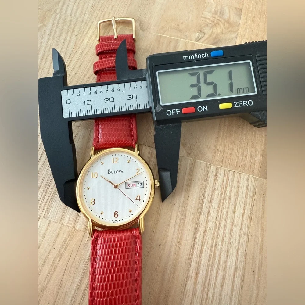 Bulova gold tone red leather watch NEW BATTERY